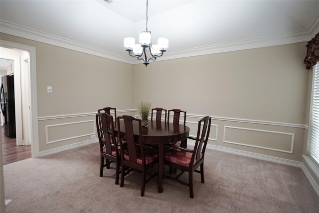 5133 Sunscape Ln S, Fort Worth, TX 76123 - dining space featuring a chandelier, light carpet, ornamental molding, a wainscoted wall, and a decorative wall
