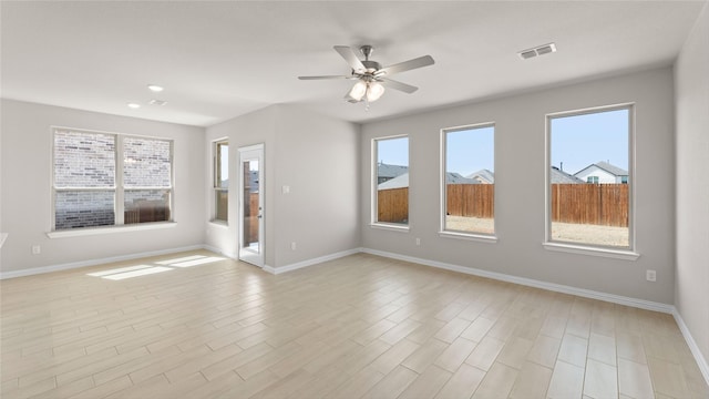 1109 Rushing Ct, Aubrey, TX 76227 - empty room with a ceiling fan, baseboards, light wood finished floors, and recessed lighting