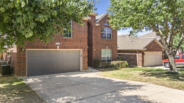 4953 Sunset Ridge Dr, Fort Worth, TX 76123 - traditional-style house with brick siding, central air condition unit, driveway, an attached garage, and roof with shingles