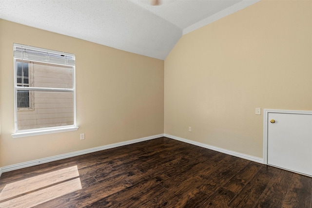 4953 Sunset Ridge Dr, Fort Worth, TX 76123 - unfurnished room featuring dark wood-type flooring, a ceiling fan, vaulted ceiling, and baseboards