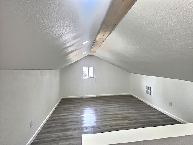 5117 Libbey Ave, Fort Worth, TX 76107 - bonus room with baseboards, wood finished floors, vaulted ceiling, and a textured ceiling