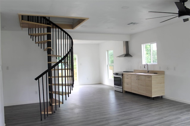 5117 Libbey Ave, Fort Worth, TX 76107 - kitchen featuring electric range, wall chimney exhaust hood, a sink, light brown cabinets, and dark wood-type flooring