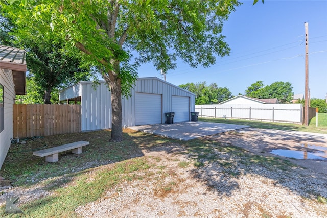 426 Brown Ave, Tuscola, TX 79562 - view of yard featuring an outbuilding, a detached garage, and driveway