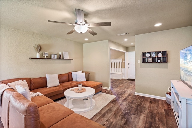 3701 Nocona Dr, Granbury, TX 76049 - living area with dark wood finished floors, a ceiling fan, a textured ceiling, recessed lighting, and a textured wall