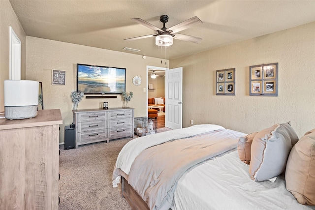 3701 Nocona Dr, Granbury, TX 76049 - bedroom with a textured wall, carpet, a ceiling fan, and a textured ceiling
