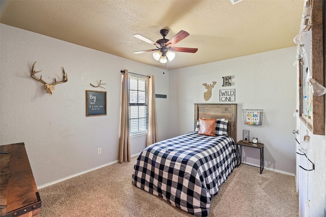 3701 Nocona Dr, Granbury, TX 76049 - carpeted bedroom featuring a textured ceiling, baseboards, and ceiling fan