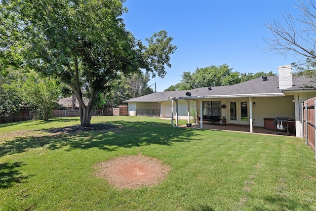 3701 Nocona Dr, Granbury, TX 76049 - back of house featuring a chimney, a patio, and french doors