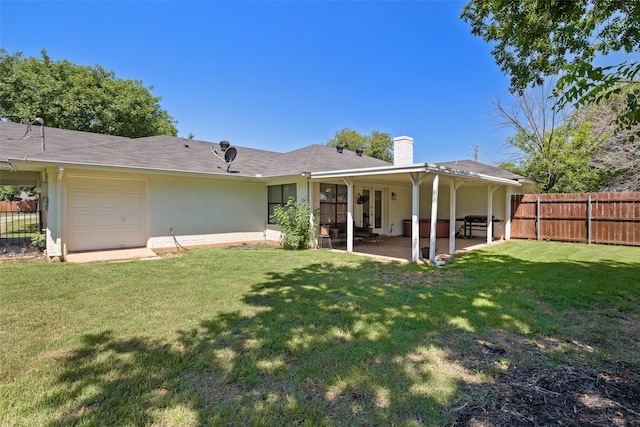 3701 Nocona Dr, Granbury, TX 76049 - back of property with a chimney, a patio area, an attached garage, and brick siding