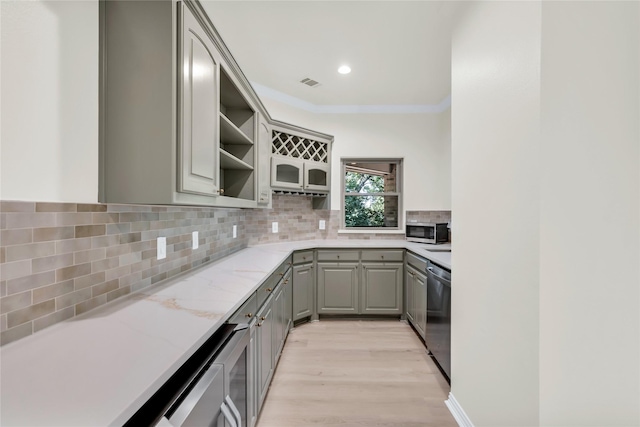 6628 Castle Pines Dr, Plano, TX 75093 - kitchen featuring gray cabinetry, open shelves, stainless steel appliances, light wood finished floors, and backsplash
