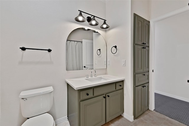 6628 Castle Pines Dr, Plano, TX 75093 - full bath featuring vanity, toilet, tile patterned flooring, and baseboards