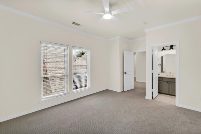 6628 Castle Pines Dr, Plano, TX 75093 - unfurnished bedroom featuring light carpet, crown molding, baseboards, ensuite bathroom, and ceiling fan