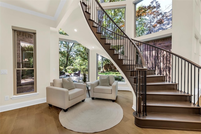 6628 Castle Pines Dr, Plano, TX 75093 - stairway with baseboards, wood finished floors, and ornamental molding