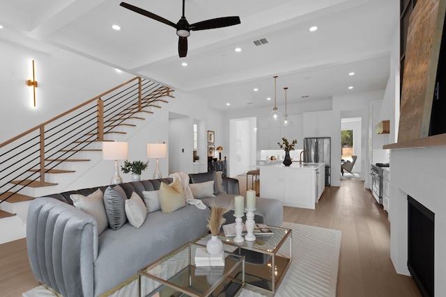 317 Rusk St, Roanoke, TX 76262 - living area featuring stairs, recessed lighting, light wood-type flooring, a ceiling fan, and beam ceiling