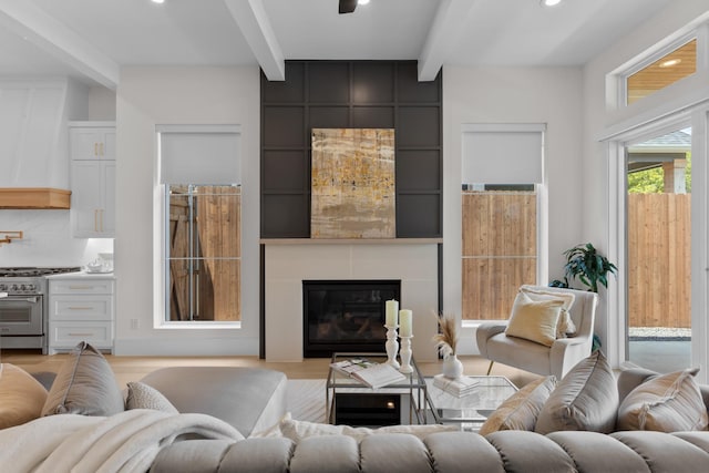 317 Rusk St, Roanoke, TX 76262 - living room featuring beamed ceiling, recessed lighting, light wood finished floors, and a fireplace