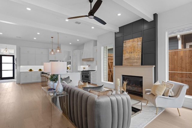 317 Rusk St, Roanoke, TX 76262 - living room with beam ceiling, a tile fireplace, light wood-style floors, recessed lighting, and ceiling fan