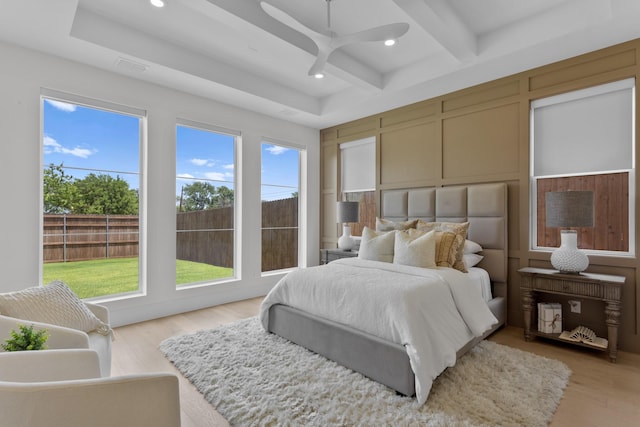 317 Rusk St, Roanoke, TX 76262 - bedroom featuring recessed lighting, beam ceiling, a decorative wall, light wood-style floors, and ceiling fan