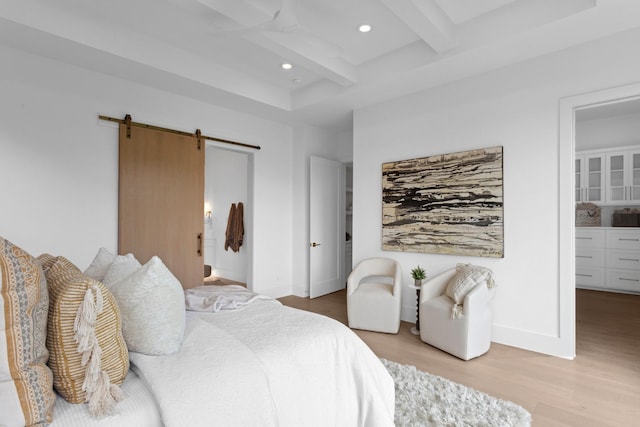 317 Rusk St, Roanoke, TX 76262 - bedroom featuring light wood-type flooring, a barn door, beam ceiling, and recessed lighting