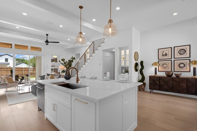 317 Rusk St, Roanoke, TX 76262 - kitchen featuring open floor plan, light wood finished floors, recessed lighting, ceiling fan, and white cabinets