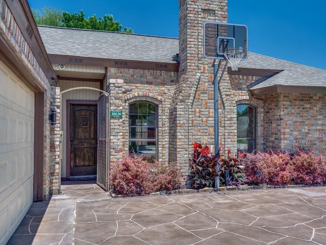18636 Crownover Ct, Dallas, TX 75252 - property entrance featuring a shingled roof and stone siding