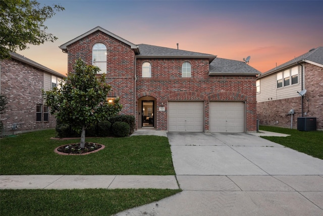 9121 Liberty Crossing Dr, Fort Worth, TX 76131 - traditional-style house featuring brick siding, driveway, a front lawn, and a garage