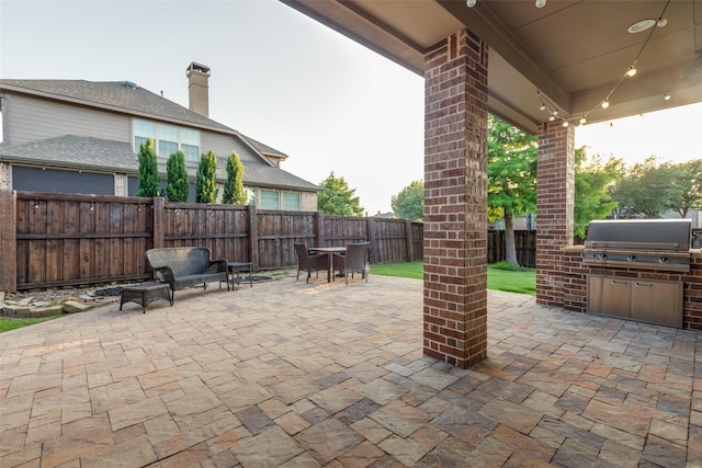 3204 Stonefield, The Colony, TX 75056 - fenced backyard with grilling area, a patio area, and outdoor dining area