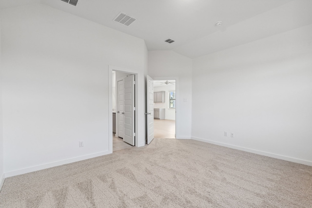 238 Twin View Vista Dr, Lavon, TX 75166 - spare room with vaulted ceiling, light colored carpet, baseboards, and a ceiling fan