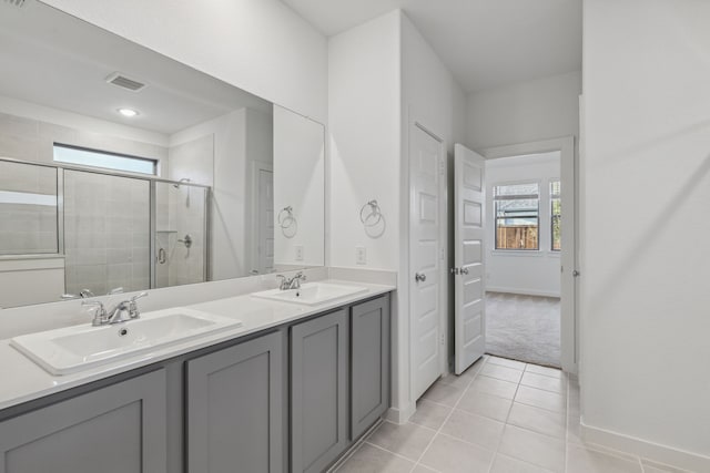 238 Twin View Vista Dr, Lavon, TX 75166 - bathroom featuring a stall shower, double vanity, tile patterned flooring, and baseboards