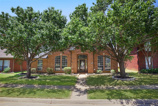 4321 Boca Raton Dr, The Colony, TX 75056 - view of front of house featuring brick siding and a front lawn