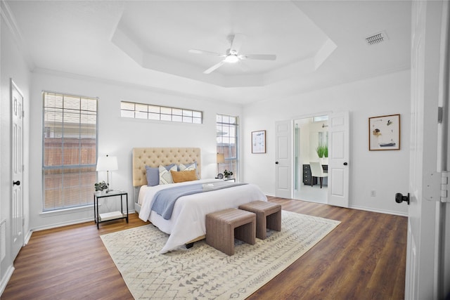 4321 Boca Raton Dr, The Colony, TX 75056 - bedroom featuring a raised ceiling, dark wood-style floors, baseboards, a ceiling fan, and ornamental molding