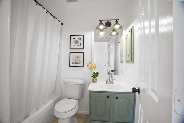 4321 Boca Raton Dr, The Colony, TX 75056 - bathroom featuring vanity, toilet, shower / bath combo with shower curtain, and baseboards