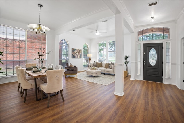 4321 Boca Raton Dr, The Colony, TX 75056 - entrance foyer with dark wood-style flooring, baseboards, crown molding, a ceiling fan, and a chandelier