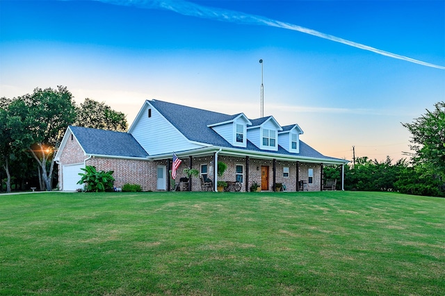 5855 Fm 1377, Princeton, TX 75407 - view of front facade with a porch, brick siding, a front lawn, and an attached garage
