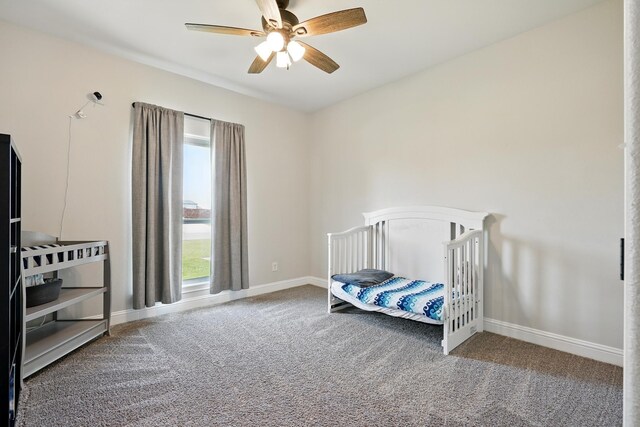 120 Oak Hill Rd, Tuscola, TX 79562 - carpeted bedroom featuring multiple windows, baseboards, and a ceiling fan