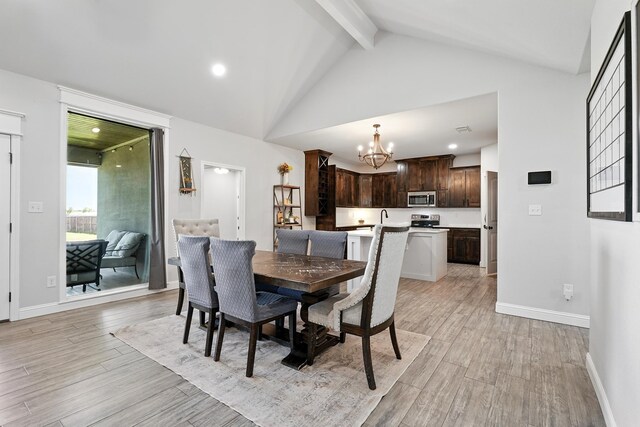 120 Oak Hill Rd, Tuscola, TX 79562 - dining space with a chandelier, beamed ceiling, light wood-style flooring, baseboards, and high vaulted ceiling