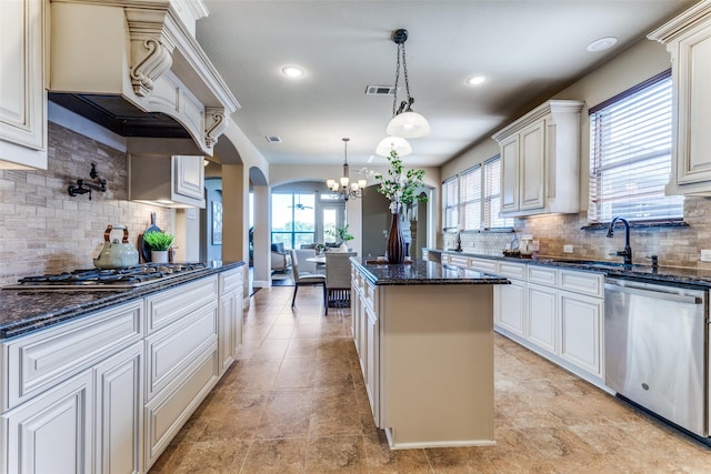 2028 Sterling Trace Dr, Keller, TX 76248 - kitchen with appliances with stainless steel finishes, a kitchen island, a chandelier, backsplash, and recessed lighting