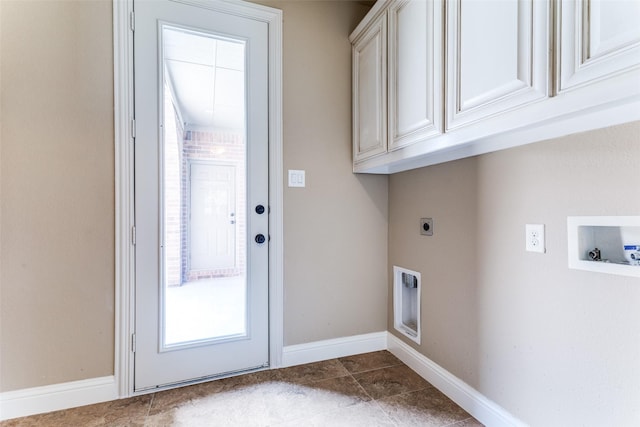 2028 Sterling Trace Dr, Keller, TX 76248 - laundry area with electric dryer hookup, cabinet space, washer hookup, baseboards, and dark tile patterned flooring