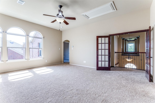 2028 Sterling Trace Dr, Keller, TX 76248 - carpeted spare room featuring attic access, a ceiling fan, arched walkways, and baseboards