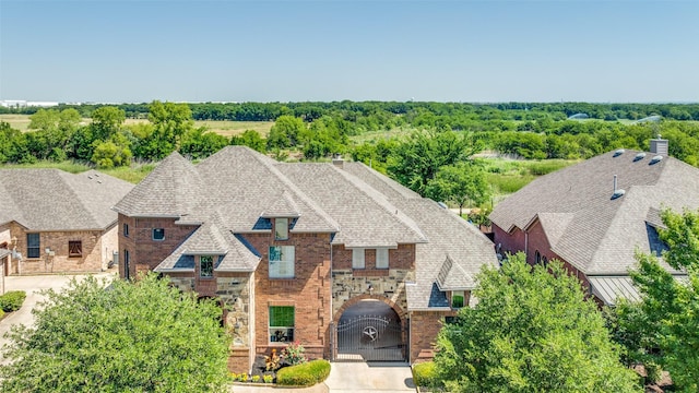 2028 Sterling Trace Dr, Keller, TX 76248 - view of front of house with stone siding, a gate, and a garage