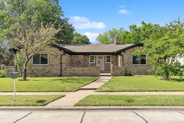 2111 Chippendale Dr, Mckinney, TX 75071 - view of front of property featuring a chimney, brick siding, and a front lawn