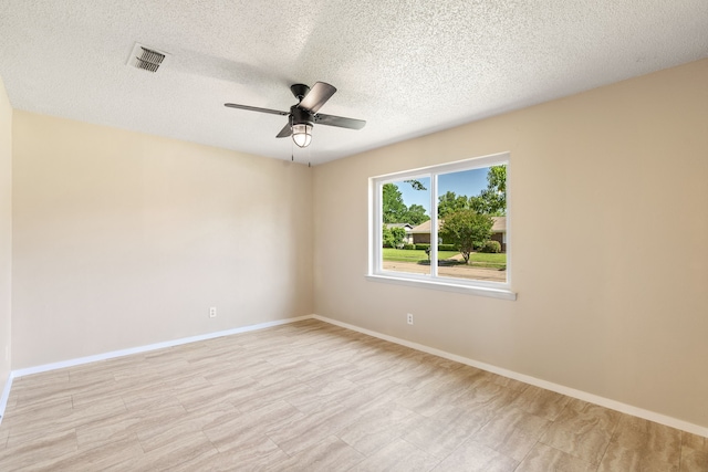 2111 Chippendale Dr, Mckinney, TX 75071 - empty room featuring ceiling fan, a textured ceiling, and baseboards