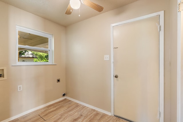 2111 Chippendale Dr, Mckinney, TX 75071 - laundry room with electric dryer hookup, light wood-style flooring, a ceiling fan, baseboards, and hookup for a washing machine