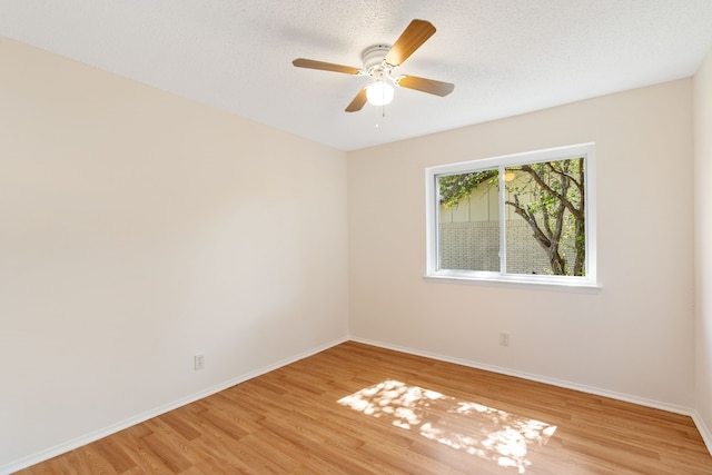 2111 Chippendale Dr, Mckinney, TX 75071 - unfurnished room with light wood-style flooring, baseboards, a ceiling fan, and a textured ceiling