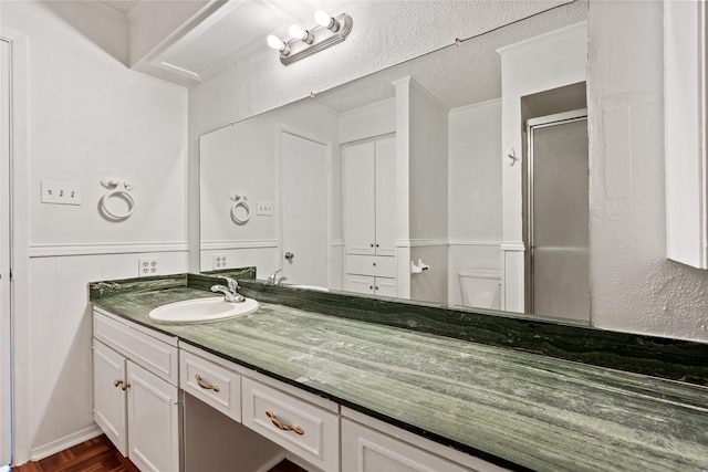 2111 Chippendale Dr, Mckinney, TX 75071 - bathroom featuring vanity, a stall shower, and toilet