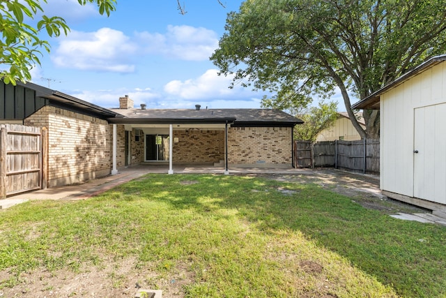 2111 Chippendale Dr, Mckinney, TX 75071 - rear view of property featuring brick siding, a patio area, and a chimney