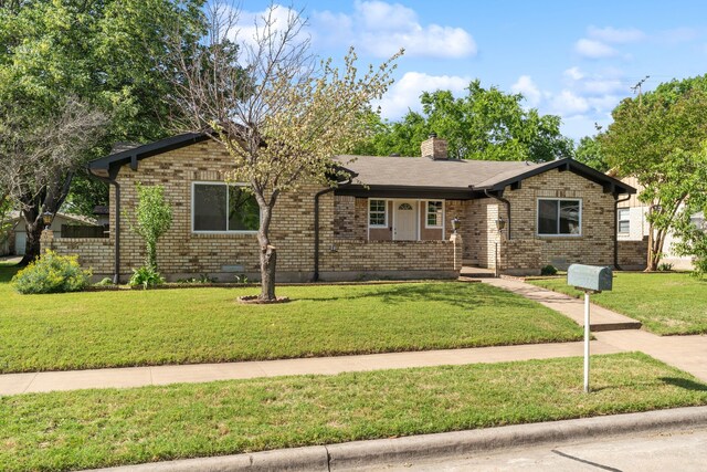 2111 Chippendale Dr, Mckinney, TX 75071 - view of front of house featuring a front yard, brick siding, and a chimney