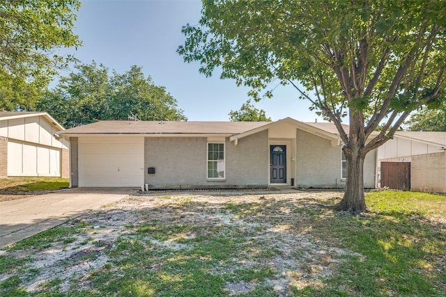 5210 Stagecoach Ln, Garland, TX 75043 - view of front facade featuring brick siding, driveway, and a garage