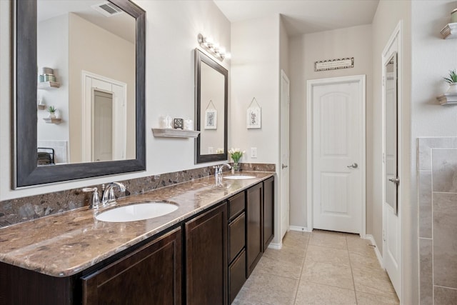 10308 Hidden Haven Dr, Mckinney, TX 75072 - bathroom with double vanity and tile patterned floors
