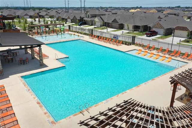 736 Hidden Feather Dr, Lavon, TX 75166 - community pool with a residential view, a patio area, and a pergola