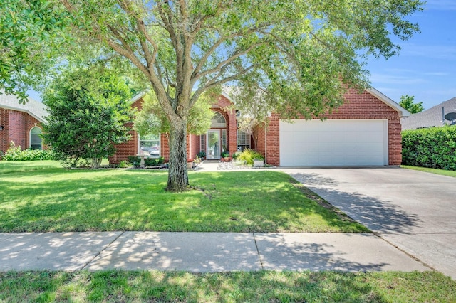 3214 Eagle Ln, Midlothian, TX 76065 - obstructed view of property with an attached garage, driveway, a front lawn, and brick siding