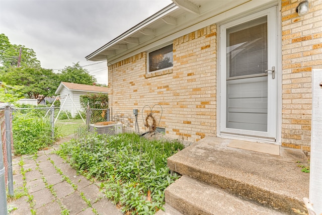 307 E Rio Grande St, Garland, TX 75041 - property entrance with brick siding and central AC unit